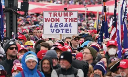  ?? Photograph: Mandel Ngan/AFP/Getty Images ?? Trump supporters on 6 January. Between January and October, 19 states enacted 33 laws to restrict voting access, according to the Brennan Center for Justice.