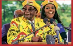  ??  ?? Robert Mugabe with his wife Grace at a Zanupf rally, 8 November