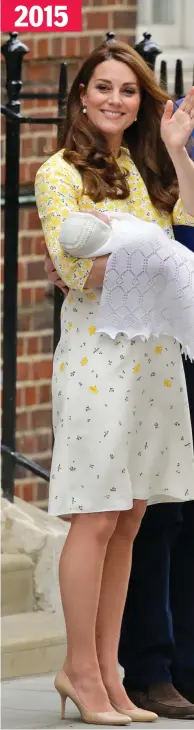  ??  ?? Smiles: Carrying Charlotte and wearing Jenny Packham again 2015