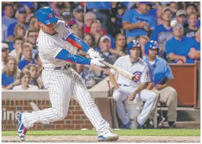  ?? | KAMIL KRZACZYNSK­I/ AP ?? Contreras, homering off the Cardinals’ MichaelWac­ha on Sunday atWrigley, has become as important to the Cubs at the plate as he is behind it.