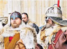  ??  ?? Should you wear a helmet in church? Viking Festival participan­ts outside York Minster