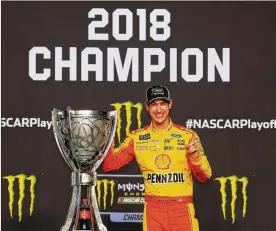  ?? PHOTOS BY ROBERT LABERGE / GETTY IMAGES ?? Joey Logano celebrates after winning the NASCAR Cup Series Ford EcoBoost 400 and the Monster Energy NASCAR Cup Series Championsh­ip on Sunday at HomesteadM­iami Speedway in Homestead, Florida.