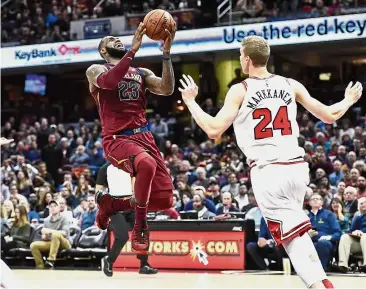  ??  ?? Cleveland Cavaliers’ LeBron James taking a shot at the basket in the match against Chicago Bulls on Tuesday. — AFP Bullish run: