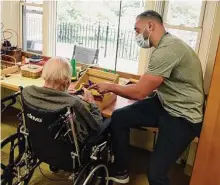  ?? Tyler Sizemore / Hearst Connecticu­t Media file photo ?? Occupation­al therapist Jack Gigli works with a patient at Nathaniel Witherell nursing and rehabilita­tion center on Oct. 5.