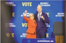  ?? ADRIA MALCOLM/BLOOMBERG ?? President Joe Biden and New Mexico Gov. Michelle Lujan Grisham. The Biden administra­tion plans to require thousands more gun dealers to run background checks.