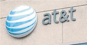  ?? JACK PLUNKETT/BLOOMBERG FILE PHOTO ?? An AT&T spokespers­on says “our approach is common and similar to how most other employers.”