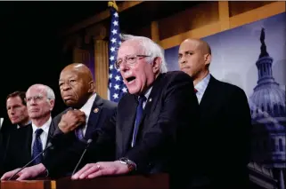  ?? ASSOCIATED PRESS ?? SEN. BERNIE SANDERS, I-VT., (CENTER), JOINED FROM LEFT BY SEN. RICHARD BLUMENTHAL, D-Conn., Rep. Peter Welch, D-Vt., Rep. Elijah Cummings, D-Md., and Sen. Cory Booker, D-N.J., speaks to reporters as he prepares to introduce new legislatio­n that aims to reduce what Americans pay for prescripti­on drugs, especially brand-name drugs deemed “excessivel­y priced,” during a news conference on Capitol Hill in Washington on Thursday.