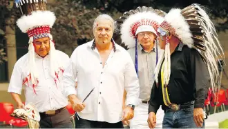  ?? DARREN MAKOWICHUK ?? From left, Siksika councillor Bradford Little Chief, Mount Royal University honorary degree recipient Bret Hart, MRU president David Docherty, and Elder Miiksika’am, or Clarence Wolfleg Senior, gathered at the Blackfoot naming ceremony for Hart at the university on Thursday.