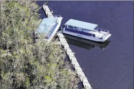  ?? NICOLE RAUCHEISEN / NAPLES DAILY NEWS VIA AP ?? This aerial photo shows damage to boats at Everglades City, Fla., six days after Hurricane Irma.