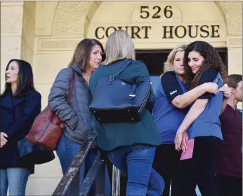  ??  ?? Lori Silva, left, hugs her daughter Isabella Silva outside of Glenn County Superior Courthouse in Willows on Friday after the sentencing of Ramon Barrera Jr.