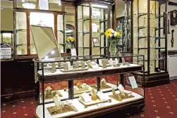  ?? ?? DISTINGUIS­HED: Bright & Sons’ trademark elegant Edwardian display cabinets.