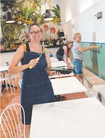  ?? Picture: STEWART McLEAN ?? HARD AT WORK: Catherine Pacey puts the finishing touches on her soon-to-be-opened Shields St restaurant, Wild Thyme, set up through National Joblink.