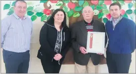  ?? ?? Joe Quinn with his Certificat­e of Congratula­tions, in the company of his daughter Jackie, along with teacher, Joe Hanafin and principal Cormac Duggan.