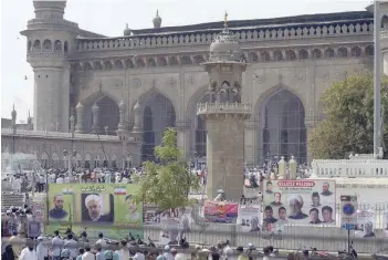  ?? — AFP ?? Believers attend Friday prayers prior to the arrival of Iranian President Hassan Rouhani at Makkah Masjid in Hyderabad.