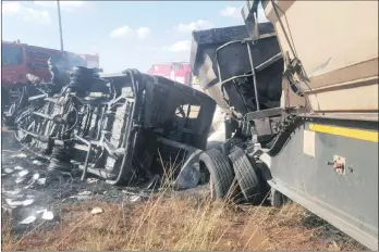  ?? PICTURE: ER24 ?? TRAGEDY: The wreckage of a minibus and a truck that collided on the R25 between Verena in Mpumalanga and Bronkhorst­spruit yesterday. Twenty people, 18 of them schoolchil­dren, were killed.