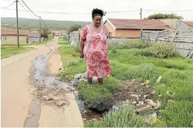  ??  ?? FILTHY STENCH: Ntomboxolo Mbixane has been battling with a constant stench and raw waste leaking onto her property in KwaNoxolo since last year