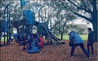  ?? CONTRIBUTE­D BY CITY OF BOYNTON BEACH ?? Residents take part in a photo shoot last week at Meadows Park. The city learned the playground will appear on the cover of Play & Park Structures’ 2018 catalog.