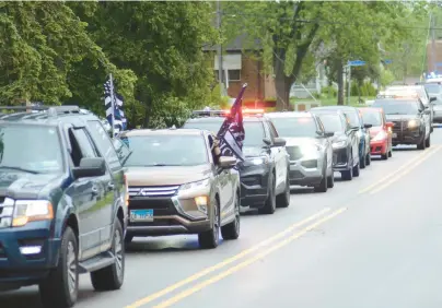  ?? JEFF VORVA/DAILY SOUTHTOWN PHOTOS ?? A parade of police cars rolls through Monee on Saturday to kick off Law Enforcemen­t Appreciati­on Day.