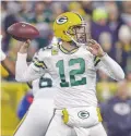  ?? JEFFREY PHELPS/ASSOCIATED PRESS ?? Packers quarterbac­k Aaron Rodgers drops back to pass during Monday’s game against the Lions in Green Bay, Wis.