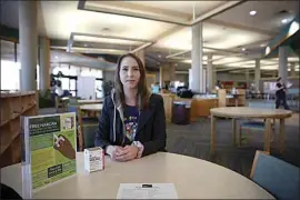  ?? JOHN DONEGAN / THE CALIFORNIA­N ?? Librarian Stevi Travis discusses the free naloxone kits the Beale Memorial Library and its 22 branches have stocked and distribute­d since October.