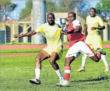  ?? Picture: EUGENE COETZEE ?? ON TARGET: Lion City’s Sixolisile Ntanjana, left, is about to bang the ball home while Highbury’s Anita Djoucheik tries to distract him in the final at the NU2 Stadium in Motherwell. Lion City won 1-0