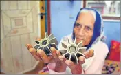  ?? PTI ?? A woman shows tails of mortar shells fired by Pakistan in Sohagpur Powal village, 30km from Jammu, on Friday.