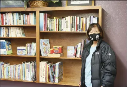  ?? SONIA WARAICH — THE TIMES-STANDARD ?? Betty Chinn stands in the reading room of Betty’s Annex, a women’s shelter she opened during the COVID-19pandemic, on Friday afternoon. Chinn opened the shelter with the help of the city and the support of neighbors after she noticed more women and their children on the street because of domestic violence fueled by the pandemic.