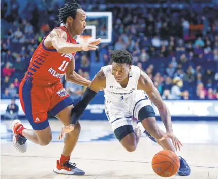  ?? KRISTEN ZEIS/STAFF FILE ?? Senior guard Malik Curry, pictured driving past Florida Atlantic’s Michael Forrest last season, led Old Dominion with 13.4 points a game last season. He’s one of three starters and seven lettermen returning from last season.