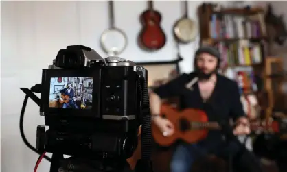 ??  ?? Musician Daniel Kahn performs a livestream­ed concert in July 2020. Photograph: Adam Berry/Getty Images