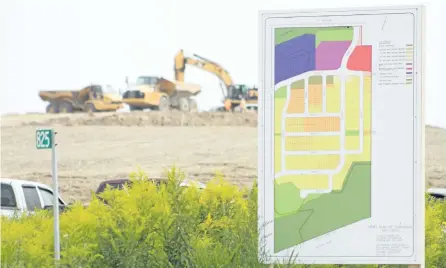  ?? JASON BAIN/EXAMINER ?? Heavy equipment is seen as crews continued to prepare a site for a subdivisio­n south of Lily Lake Rd. on Monday. The draft subdivisio­n plan for the 114.8-hectare site was approved Monday night by city council’s planning committee.