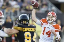  ?? PETER POWER, THE CANADIAN PRESS ?? Lions quarterbac­k Travis Lulay came in early to strafe the Tiger-Cats in a 41-26 B.C. win.