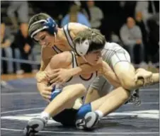  ??  ?? CR North 126-pounder Tim Ambacher (top) defeated Harry Murray.