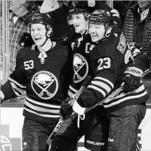  ?? ASSOCIATED PRESS FILE PHOTO ?? From left, Jeff Skinner, Jack Eichel and Sam Reinhart celebrate a goal against Toronto on Dec. 4.