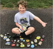  ?? PHOTO COURTESY OF SHERRI RUSSO ?? Jack Russo, 6, has a whole new set of rocks he and his mom painted that are ready for distributi­on.