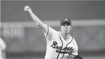  ?? JAMIE SQUIRE Getty Images/TNS ?? Former Braves pitcher Greg Maddux, seen in 2002, believes pitchers today are encouraged too much to go for velocity rather than location.