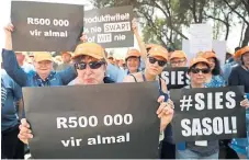  ?? /Reuters ?? Race divide: Members of Solidarity protest at a Sasol plant in Sasolburg against a share scheme for black staff in September.