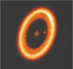  ?? ALMA (ESO/NAOJ/NRAO) / BENISTY ET AL / HANDOUT VIA REUTERS ?? The Jupiter-like world, called a circumplan­etary disk, is one of more than 4,400 planets that have been
discovered outside our solar system.