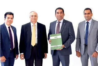  ??  ?? Representa­tives of the senior management of Commercial Bank’s Bangladesh operation with the AAA rating certificat­e (from left) Financial Controller Binoy Gopal Roy, Senior General Manager Dilip Das Gupta, CEO Varuna Kolamunna and Chief Operating Officer Kapila Liyanage