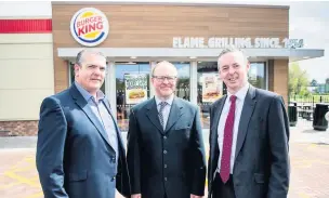  ?? Picture: Aled Llywelyn ?? From left, Chris Baker, director of Unionburge­r with Dennis Cattell, centre manager of Parc Torstre Retail Park and Huw Thomas of Cooke & Arkwright.
