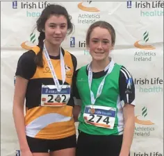  ??  ?? Ashford AC’s Ellen Savage and Parnell AC’s Laci Jane Shannon after the Irish Life Health National Juvenile ‘B’ championsh­ips in Dundalk.