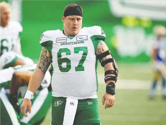  ?? TROY FLEECE ?? Coming off his first all-star season, Saskatchew­an Roughrider­s centre Dan Clark has rejected free agency and signed a two-year extension with the Green and White.