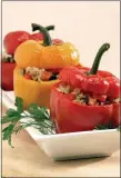  ?? PHOTO BY NICK KOON ?? Sweet-Sour Vegetarian Stuffed Bell Peppers feature a mix of raisins, pine nuts rice and a blend of seasonings. der, 35-45 minutes. Sprinkle with remaining lemon juice and serve.