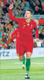  ?? REUTERS/AP ?? Harry Kane (left) scored thrice in England’s 7-0 win over Montenegro, while Cristiano Ronaldo’s hat-trick helped Portugal to a 6-0 win over Lithuania. With the win, England secured top spot in Group A to secure a berth at the 2020 UEFA European Championsh­ip.