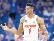  ?? WILFREDO LEE/AP ?? Devin Robinson and the Gators dismantled Virginia, which came into the game with the nation’s top defense, 65-39