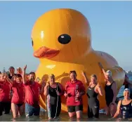  ?? — AFP ?? An Australian swimming club is appealing for ocean watchers to find their giant yellow inflatable duck Daphne, after the mascot was blown into the Indian Ocean with reported sightings hundreds of kilometres from where it was launched. The duck, owned...