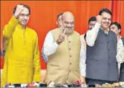  ?? PTI ?? (From left): Shiv Sena chief Uddhav Thackeray, BJP president Amit Shah and Maharashtr­a CM Devendra Fadnavis on Monday.