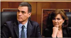  ?? — AFP ?? Prime Minister Pedro Sanchez and Deputy Prime Minister and minister of equality Carmen Calvo attend a debate on the government’s budget during a parliament session in Madrid on Wednesday.