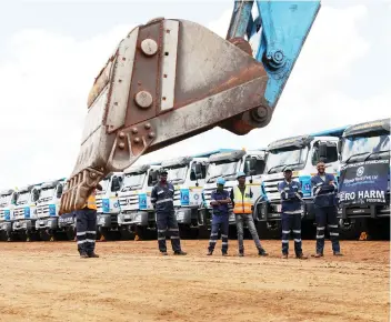  ?? — Picture: Joseph Manditswar­a ?? Bitumen World workers look on as an excavator breaks ground for commenceme­nt of the constructi­on of the new Parliament building access road in Mt Hampden on Thursday. The road will connect Mazowe Road and the building. It will have eight lanes, four on the right side and four on the left. Works will be concluded by mid-year.