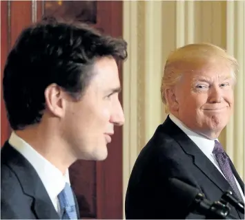  ?? SEAN KILPATRICK/CP FILES ?? Prime Minister Justin Trudeau and U.S. President Donald Trump speak to reporters last month at the White House in Washington, D.C. The two leaders, along with Mexican President Enrique Peña Nieto, could find themselves renegotiat­ing NAFTA as early as...