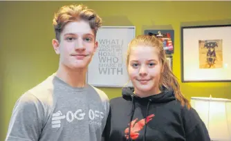  ?? ANDREW ROBINSON/THE TELEGRAM ?? Siblings Darcy and Reagan Scott of Conception Bay South mostly discover new music on their family's shared Apple Music account.